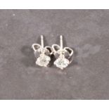 A pair of diamond ear studs, claw set in 18ct white gold, total approx 0.42ct