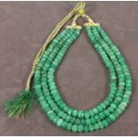 A light green beaded necklace, strung on a gold and green cord, total approx 806.50 ct