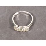 A diamond three stone ring, the round brilliant cut stones totaling approx. 1.20ct claw set in