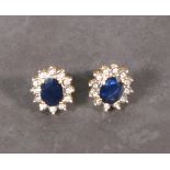 A pair of sapphire and diamond ear studs, claw set in 9ct yellow gold