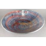 Chloe MANSELL (British 20th/21st Century) An iridescent bowl of red and blue linier design, signed