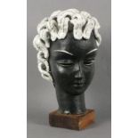 Baldelli ceramic head, modelled with white hair, mounted on a wooden base, incised 'Baldelli Made in