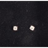 A pair of diamond ear studs, the round brilliant cut stones claw set in 18ct white gold