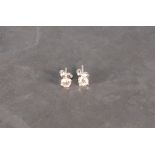 A pair of diamond ear studs, the round brilliant cut stones claw set in 18ct white gold