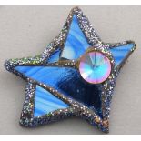 Andrew LOGAN (British b. 1945) Blues smoked mirrored brooch in the form of a asymmetric star