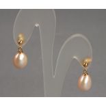 A pair of pearl drop earrings, the pink/peach drops suspended from 9ct gold studs, boxed