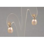 A pair of pearl and diamond set drop earrings, the oval pears suspended from diamond set bails,