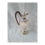 A Victorian half-fluted water jug with an urn finial to hinged cover - 8.5" high - 1893 - 342gms all