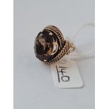 A large smoky quartz ring in 9ct - size J - 8.6gms