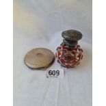 A damaged silver and red glass overlay scent bottle and a compact with mirror interior