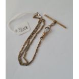 A long link watch chain in 9ct - 9.8gms