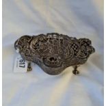 An attractive oval shaped dressing table box, pierced and embossed with coach, horses and bells - 5"