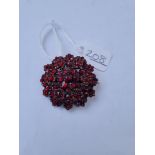 A garnet cluster brooch