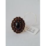 A large antique red stone ring on silver shank - size P