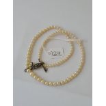 A cultured pearl necklace with marcasite and silver clasp