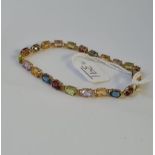 A multi-stone bracelet in 9ct - 5.6gms