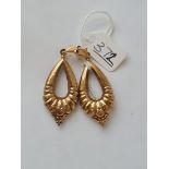 A pair of embossed earrings in 9ct - 3.8gms