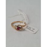A diamond & red stone ring marked DIA in 9ct - size P - 2.09gms