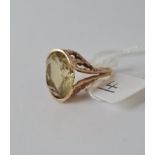 A large yellow stone dress ring in 9ct - size L - 5gms