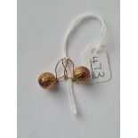 A pair of ball shaped earrings in 9ct - 1.3gms