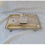 An inkstand with gadroon border and four bracket feet - 8.5" long - London 1924 -The inkpot B'ham