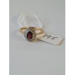 A garnet and diamond cluster ring set in 18ct gold - size O - 3.4gms