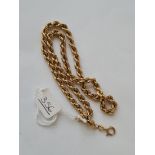 A rope-link neck chain in 9ct - 9gms