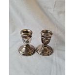 A small pair of mounted candlesticks - 2.5" high - London 1924