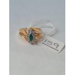 A emerald & diamond oval cluster ring in 10ct gold - Size O - 3.90gms