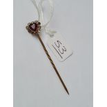 A garnet and paste stick pin