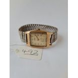 A oblong cased wrist watch by J.W.BENSON with seconds dial in 9ct with metal bracelet