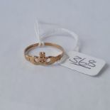 A diamond claddagh ring in 9ct - size Q