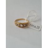 An antique 5 stone pearl ring in 18ct gold - size R - 4.5gms