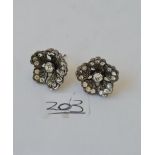 An early pair of diamond earrings set in gold and silver