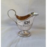 A helmet-shaped cream jug, half-fluted with reeded rims - Sheffield 1893 MARTIN HALL - 80gms