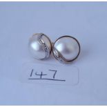 A pair of pearl & diamond fancy earrings in 9ct - 7.3gms