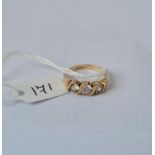 A three stone dress ring size N in 9ct mount 2.2g inc