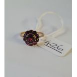 A garnet cluster ring in 9ct - size H