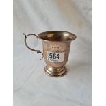 A christening mug with leaf capped scroll handle - 3" high - B'ham 1907 - 68 gms