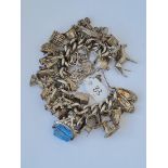 Good heavy silver charm bracelet set with oodles of charms 156g