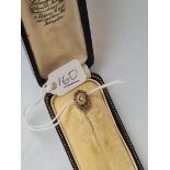 A vintage stick pin with central diamond in 15ct gold - original box