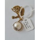 A fancy 9ct pearl & diamond pendant on a 9ct chain - 5.4gms