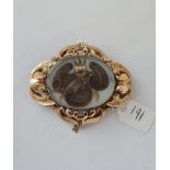 A good gilt antique mourning brooch with pearl centre