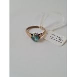 A blue stone solitaire ring in 9ct - size O - 2.2gms