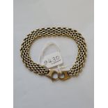 A MESH BRACELET IN 9CT - 22.9gms