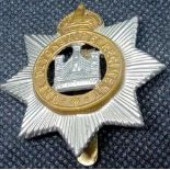 A Devonshire Reg badge & a Devonshire Reg post card 1915