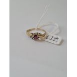 A purple and white stone dress ring in 9ct - size R - 2.1gms