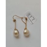 A pair of pearl-set drop earrings in 9ct