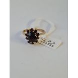 A garnet cluster ring in 9ct - size V