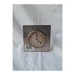 A travelling clock with a sealed dial with an 8 day Swiss movement - 3.25" high
